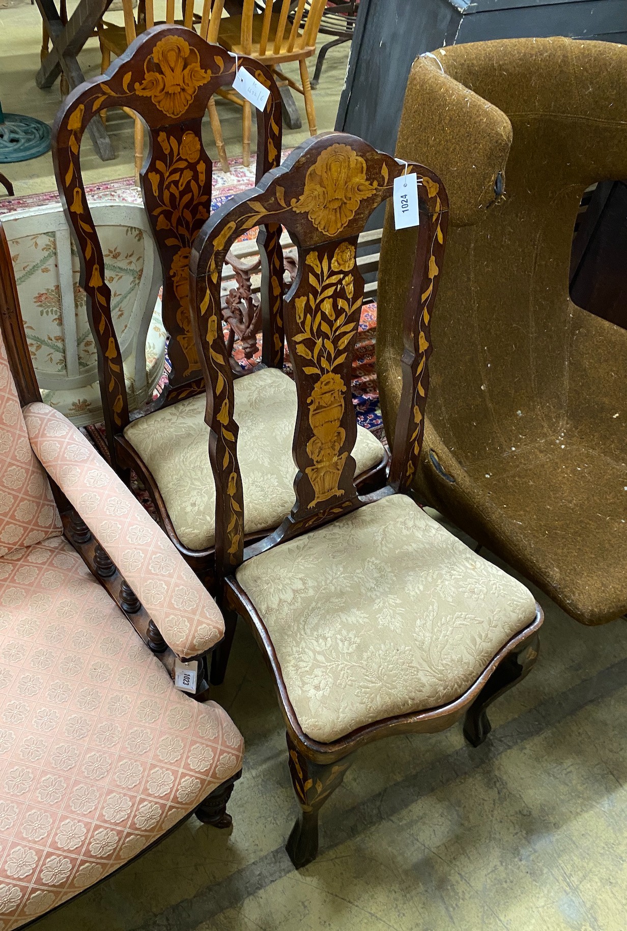 A pair of late 18th century Dutch walnut and marquetry dining chairs